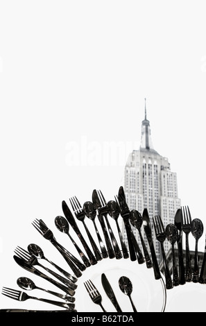Cutleries superimposed on a building, Empire State Building, Manhattan, New York City, New York State, USA Stock Photo