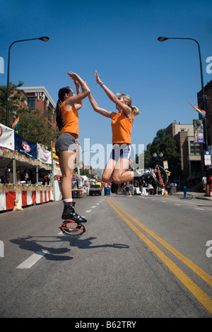 Two Women Giving High Five Perspiring Outdoors Stock Photo - Alamy