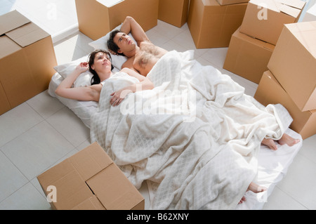 Couple lying on the bed Stock Photo