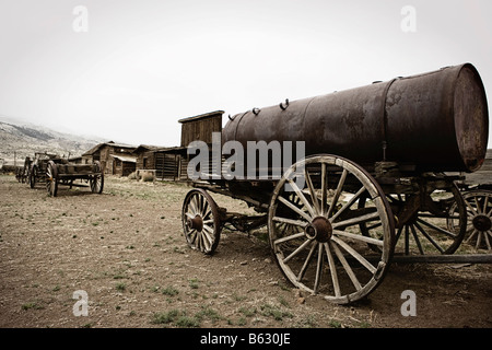 Abandoned horse carts in a field, Old Trail Town, Cody, Wyoming, USA Stock Photo