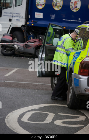 Metropolitan traffic Police investigate the collision between a motorbike and a London borough of Lambeth recycling vehicle Stock Photo