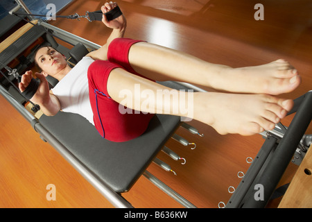 High angle view of a young woman exercising in the gym Stock Photo
