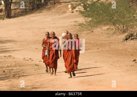 Young monks on a road, Bagan, Myanmar Stock Photo