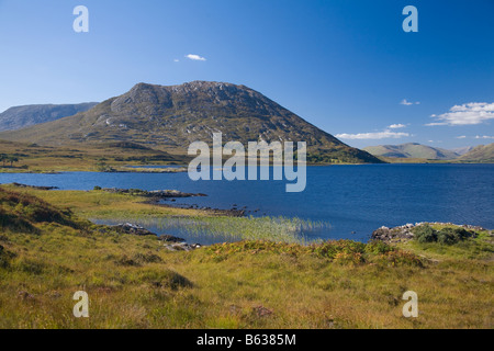 Lackavrea mountain on the northwestern shore of Lough Corrib. Maumturk Mountains, Connemara, County Galway, Ireland. Stock Photo