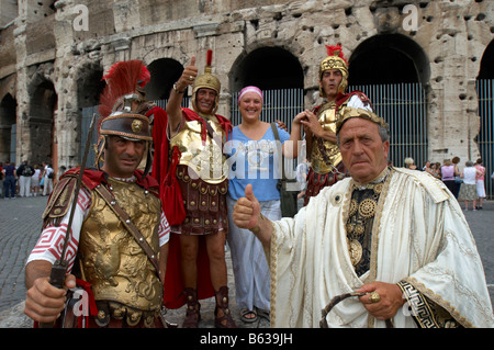 Julius Caesar and Roman centurions meet tourists outside the Colosseum in Rome, Italy Stock Photo