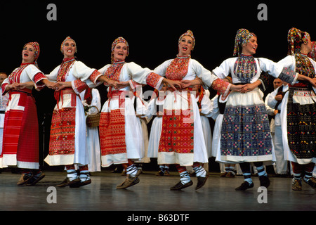 A Croatian Folk Dance Group performing on Stage in Traditional Costume Stock Photo