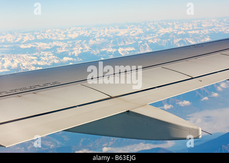 A part of the wing of an airplane while on flight Stock Photo