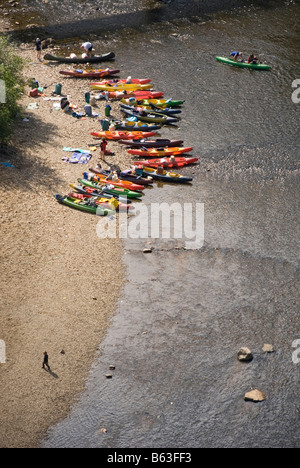 Kayaks and Canoes lying on riverbank, people, River Moldau, Cesky Krumlov, UNESCO World Heritage, Czech Republic, East Europe Stock Photo