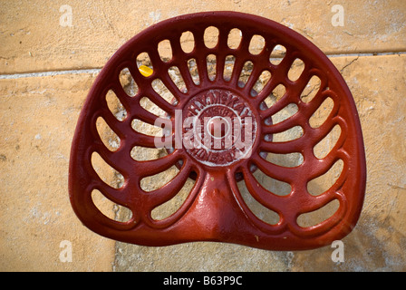 Seat from antique Sunshine Tractor, now part of childrens' playground. Guildford, Perth, Western Australia Stock Photo