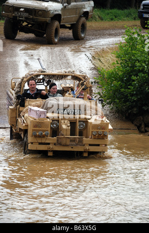 Special Air Services SAS Land Rover entering the water Registration number AHA 675B Built on a Series IIA model often called Stock Photo