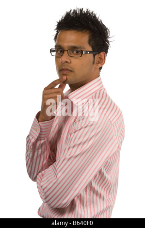 Asian male in glasses isolated on a white background thinking Stock Photo