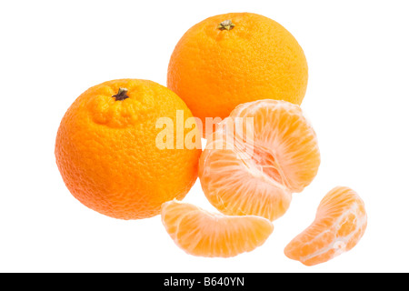 three tangerine oranges isolated on white background one orange has been peeled Stock Photo