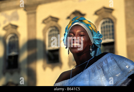 Brazil, Salvador de Bahia, Woman in front of cathedral. Stock Photo