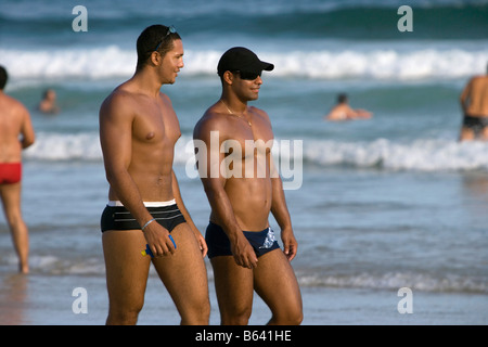 Brazil, Sao Paulo, Nice looking men at Beach at Praia Enseada in Guaraja. Stock Photo