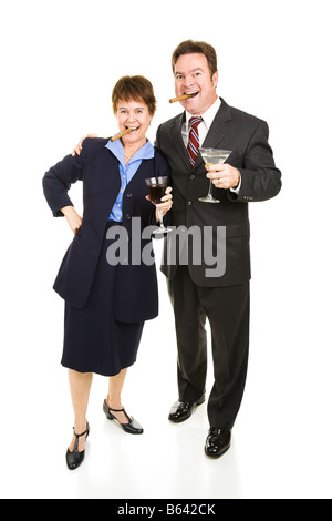 Business partners celebrating their success with cigars and cocktails Isolated on white Stock Photo