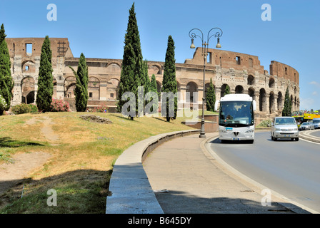 A white bus on a sightseeing tour near the Colosseum, Rome, Lazio, Italy, Europe.
