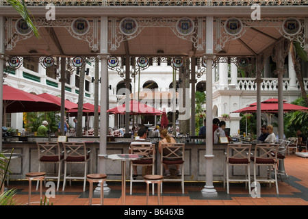 People at the Raffles Hotel Courtyard Bar, Singapore Stock Photo