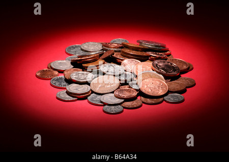 Pile of coins on red background Stock Photo