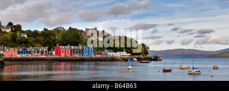 Panoramic photo of sea front and harbourside of Tobermory, Isle of Mull, Scotland taken on a bright but cloudy day Stock Photo