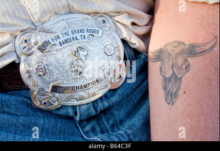 Texas Hill Country, Dixie Dude Ranch, rodeo cowboy's belt buckle and tattoo Stock Photo