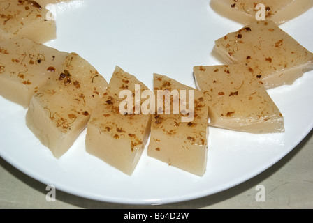 Sticky steamed sweetened glutinous rice flour cake nieng gao Dim sum lunch dish at the Lu Bo Lang Restaurant in City God Temple Stock Photo