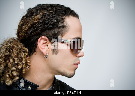 profile of young men wearing sunglasses, studio portrait Stock Photo