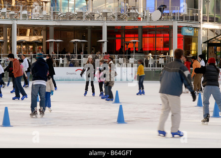 Skaters maneuver the packed Pond at Bryant Park ice skating rink in New York Stock Photo