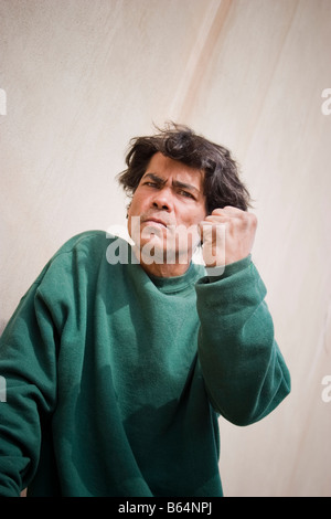 Young Hispanic man posing MODEL RELEASED Stock Photo