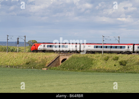 Voyager 221 114 on ECML near Scottish Border, in debadged Virgin livery heading north. Stock Photo