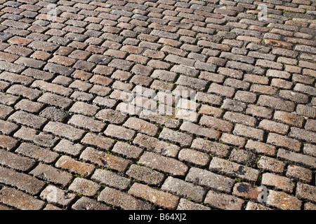 Cobblestones road surface close up in Plymouth, Devon UK. Stock Photo