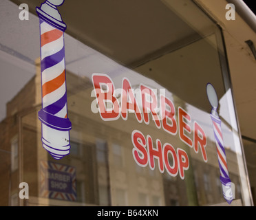 Barber shop sign in a store window Stock Photo