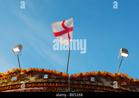 The flag of St George on a merry go round ride at a London fair Stock Photo