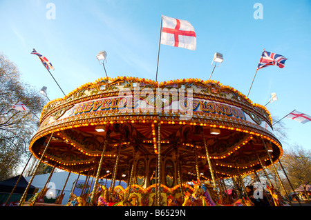 A merry go round ride at the fair Stock Photo