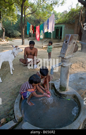India, Lucknow, Uttar Pradesh, Countryside near Rae Bareli, Children washing hands with soap. Stock Photo