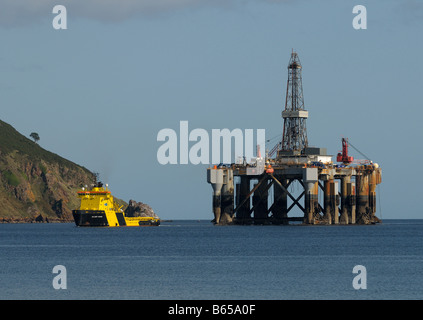 Oil Rig on the way to Invergordon for repairs passing the Cromarty Gap and the village of Cromarty Stock Photo
