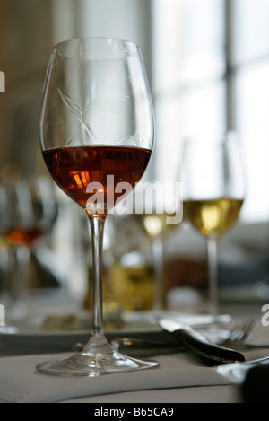 Glass of sherry, other glasses of wine in background Stock Photo