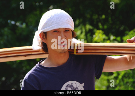 A young Japanese carpenter building a house Stock Photo