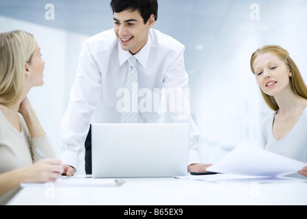 Professionals working at desk Stock Photo