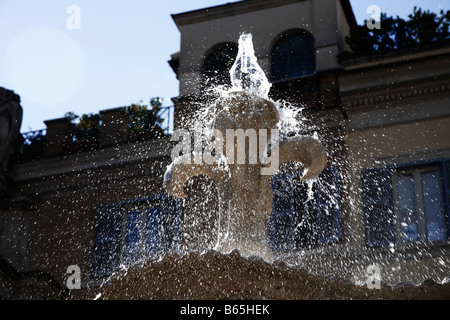 splashing water droplets and fountain Piazza Farnese Rome Stock Photo