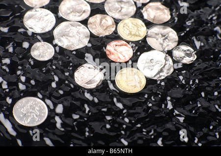 BRITISH MONEY SINKING IN MURKY WATERS Stock Photo