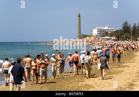 Crowds of tourists walking on beach Maspalomas Gran Canaria Spain Stock Photo