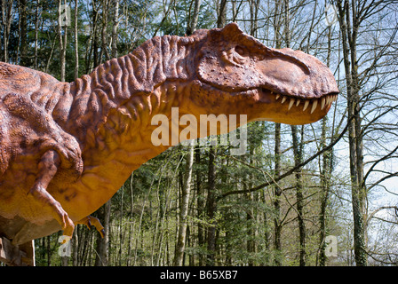 Dinosaur - Tyrannosaurus Rex, a velociraptor, at Dino Zoo, Charbonnières les Sapins, France by Charles W. Lupica Stock Photo