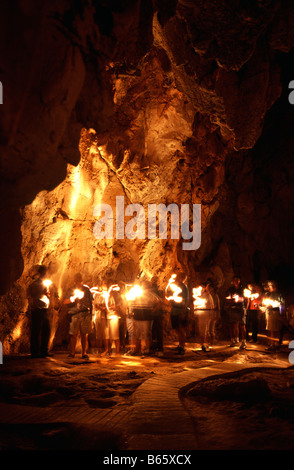 The inside of the Royal Arch Cave in Chillagoe National Park The walls are illuminated by torches from a tour group, Queensland Stock Photo