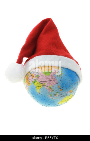 Globe showing Asia wearing Santa hat isolated on white