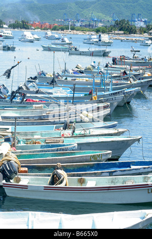 Row of fiberglass fishing boats anchored in Mexico Stock Photo