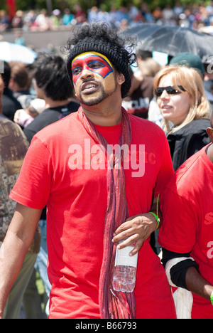 Young man in high spirits enjoying the Chinese New Year festivities. Stock Photo