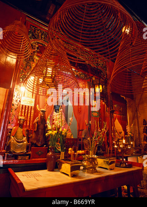 Spiral incense coils burning in Man Mo Temple Sheung Wan district Hong Kong Stock Photo