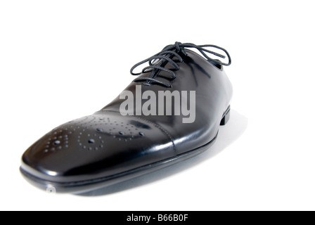 Close up of the toe of a black polished shoe on a white background Stock Photo