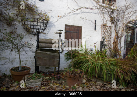 Old antique victorian Mangle used to wring out clothes as garden ornament at Hubbards Hills, Louth, Lincolnshire, England Stock Photo