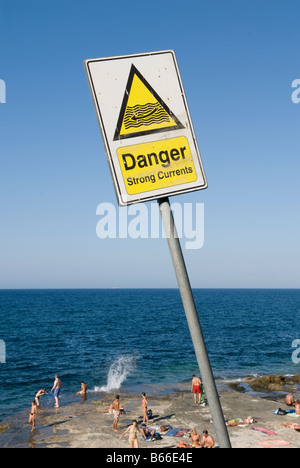 Strong currents warning sign at the beach, Sliema Malta Stock Photo